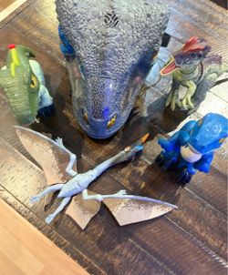 Mask and 4 dinosaurs—all new and in perfect working order.