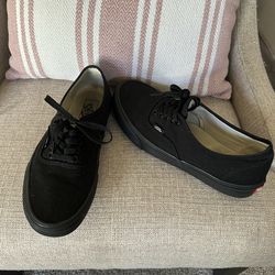 Black canvas Vans shoes