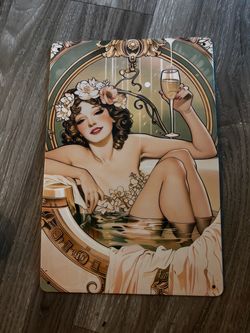 Metal sign girl in tub holding champagne