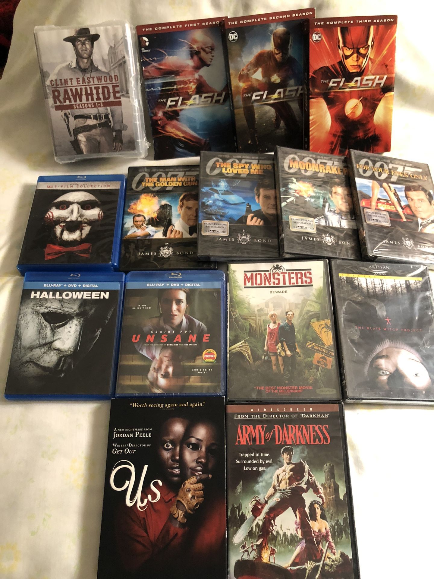 DVD TV Series Rawhide Seasons 1-3 New$25,DVD Bond Set $10,CW Network The Flash Seasons1-3 $30,BluRayDVD 8 Film Set SAW$10,Other Movies $3 Each