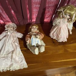 $70  Set Of 3 Porcelain Dolls