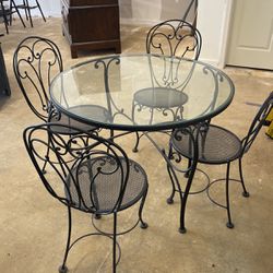 Patio Furniture - Glass Table With Four Wrought Iron Chairs