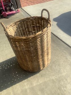 Large woven wicker laundry basket with handles