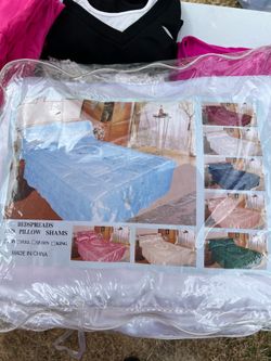 white bedspread with pillow shams