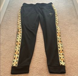 Nike black and gold women’s joggers medium