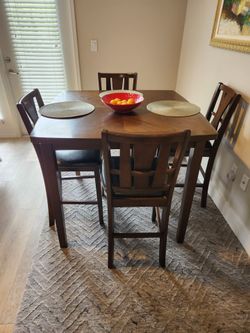 Dining table with counter height seats