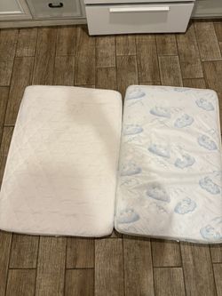 Crib Mattress (right) Playpen Mattress (left)