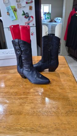 vintage blue Laredo leather western cowgirl boots featuring a pointed toe, stacked heel, and a decorative side tassel and fringe detail.