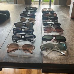 Box of sunglasses some new some used