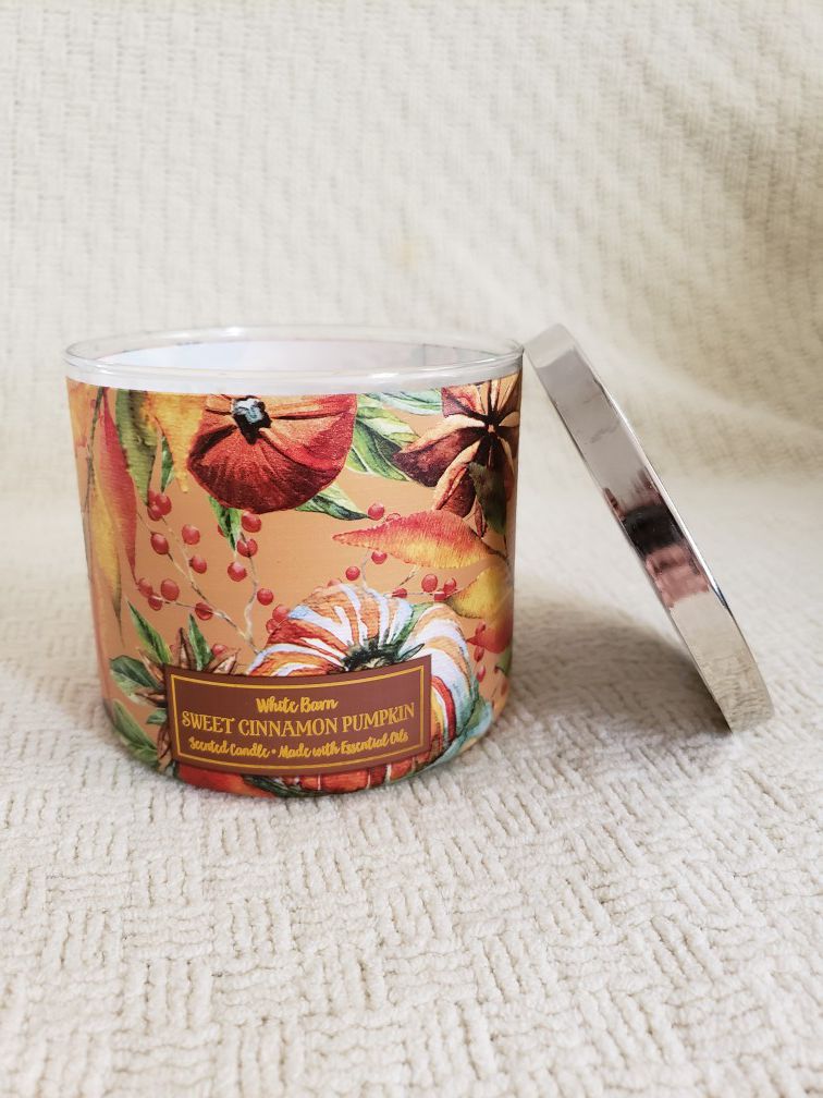 New, 3 wick sweet cinnamon pumpkin candle from Bath and Body Works.