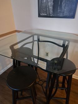 Glass top dinning room table and bar stools