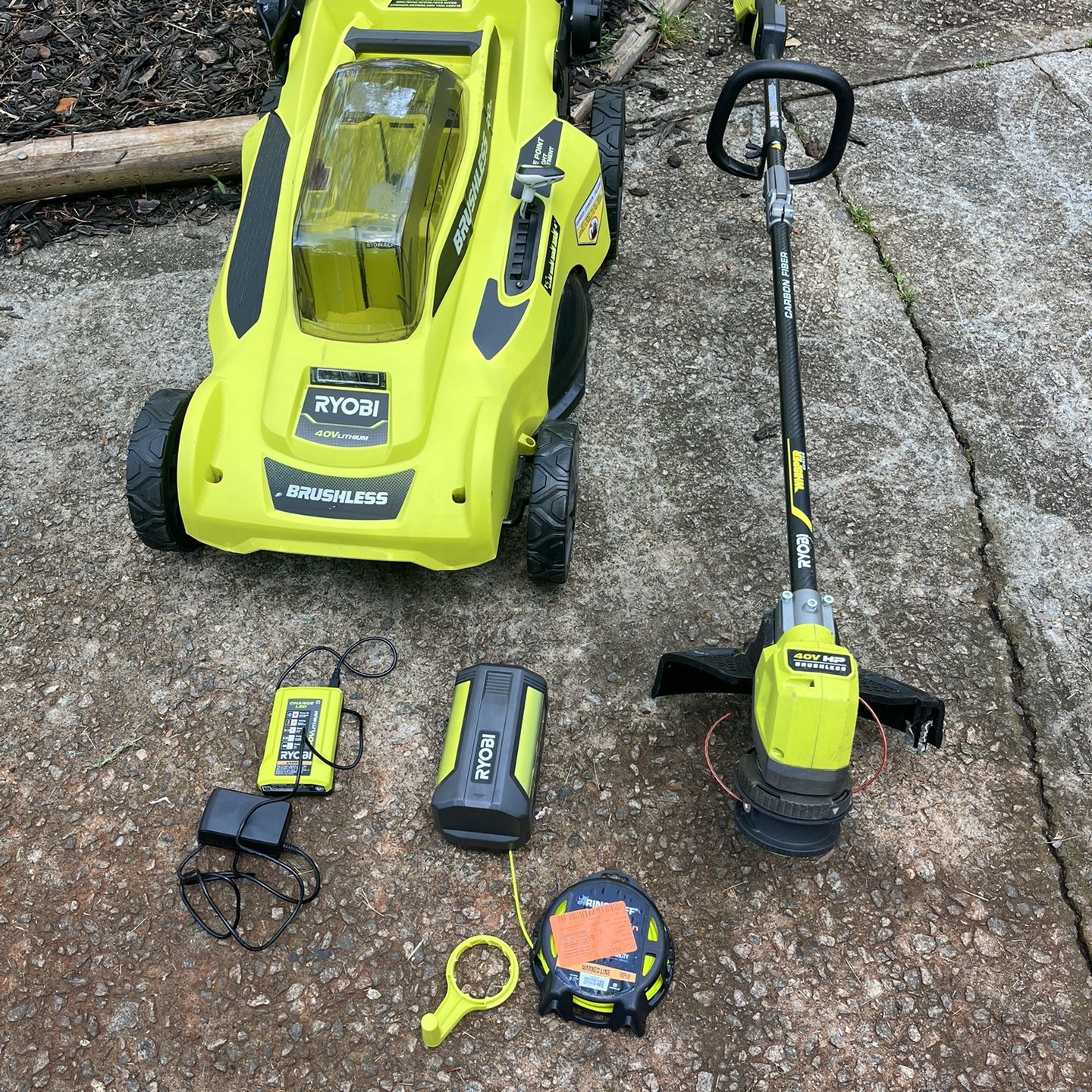 Ryobi 40 V 20 inch push mower and string trimmer one battery one charger used 200