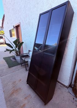 Cabinet with partial glass doors and shell.