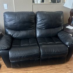 Ashely’s Leather Reclining Love Seat