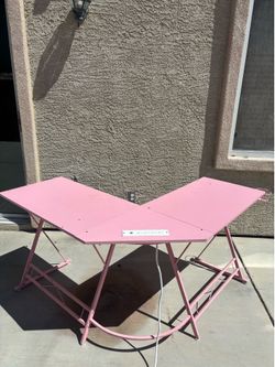 Pink L Shaped desk with power outlets built in