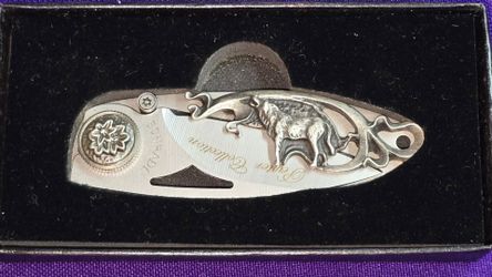 Vintage Collectible Schrade Pewter Collection Wolf (SCWSW) folding pocket knife from the Wildlife Series, presented in its original display box.