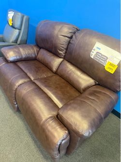 Brown leather loveseat power recliner