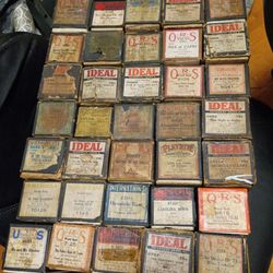 Case of 1920s player piano player scrolls