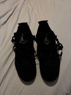 Black cat Jordan 4s