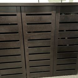 Dark wood shoes and purses cabinet