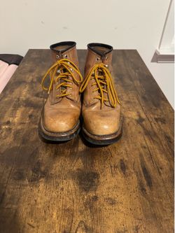 Golden retriever brand work boots featuring a classic tan leather upper and bright yellow-and-red laces price (Size 9.5)