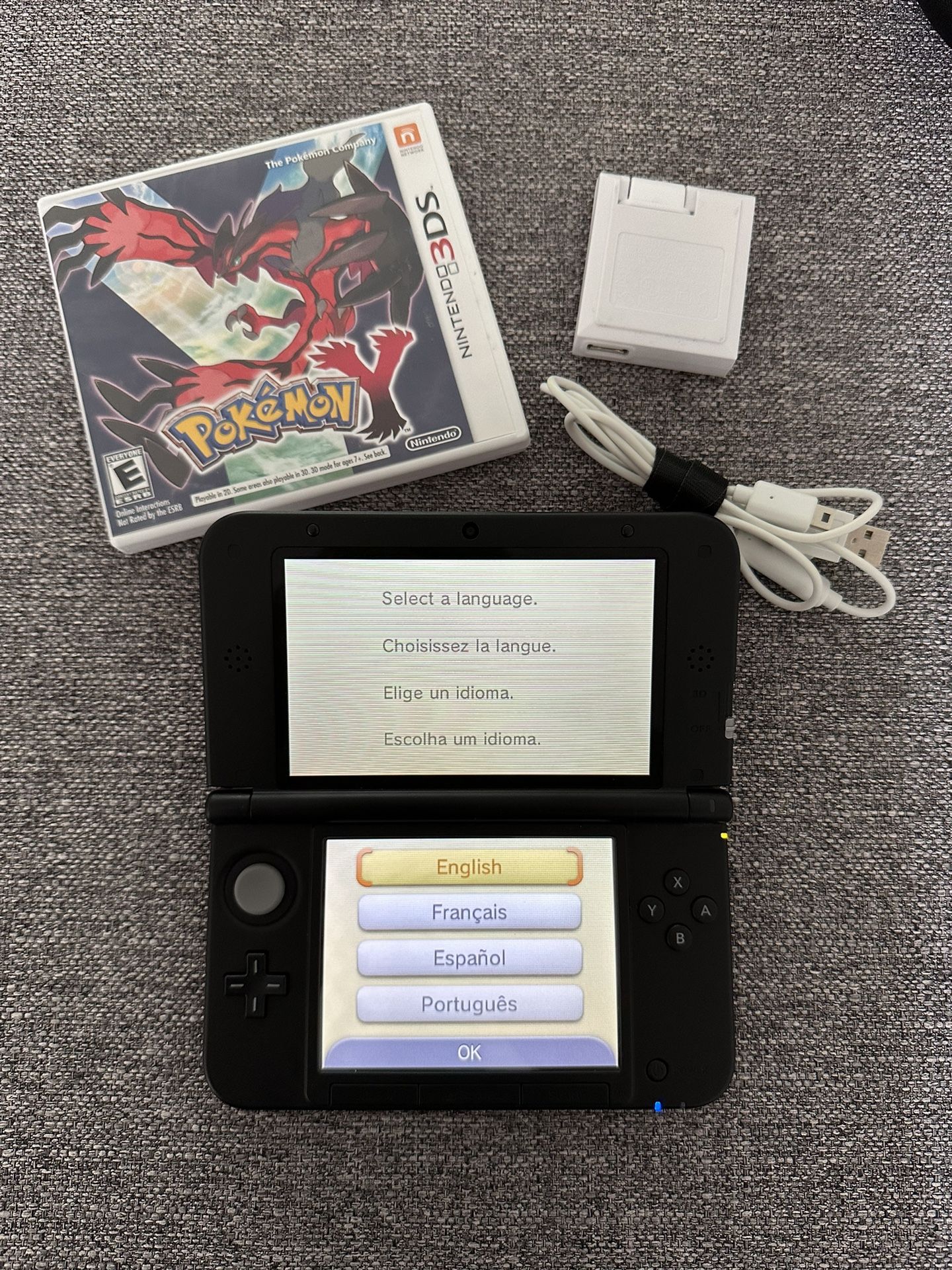 Red Nintendo 3DS XL with Pokémon Y