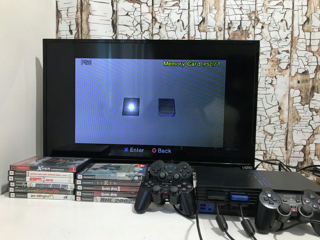Ps2 console with 3 Controllers, 2 Memory Card, 12 Games
