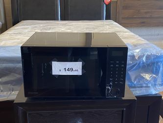 Brand new black microwave kitchen appliance