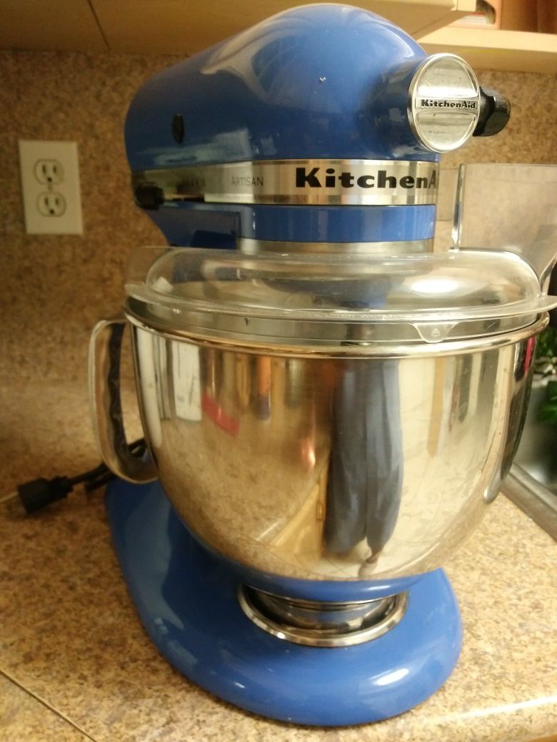 KitchenAid tilt-head stand mixer with accessories and recipe book