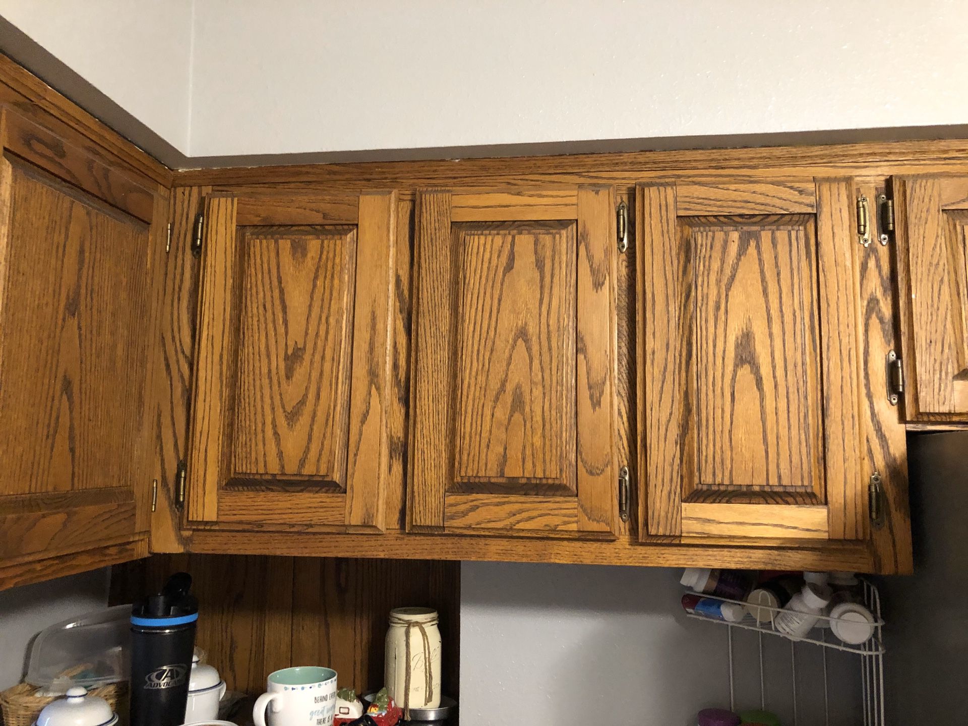 Oak kitchen cabinets with appliances
