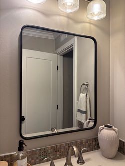 Black rounded mirror