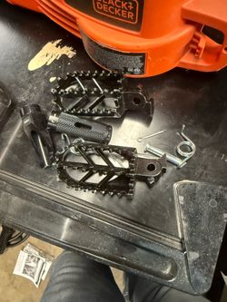 Wide after market foot pegs