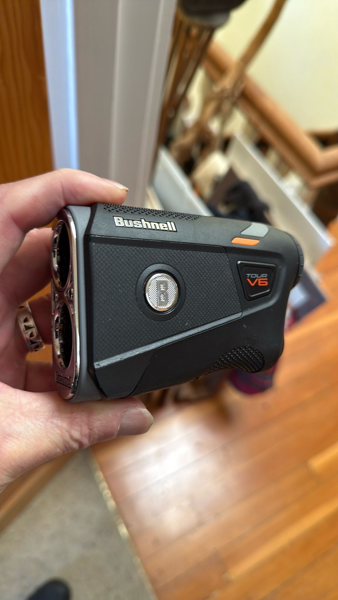A Bushnell Tour V6 Range Finder. Golf Clubs