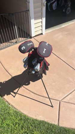 Power Bilt golf clubs  5-PW, putter, driver, 3 and 5 woods, and stand-up bag