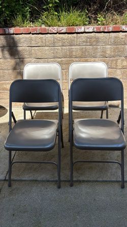 Four metal folding chairs