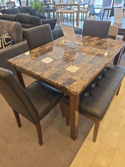 I table 3 chairs and a bench