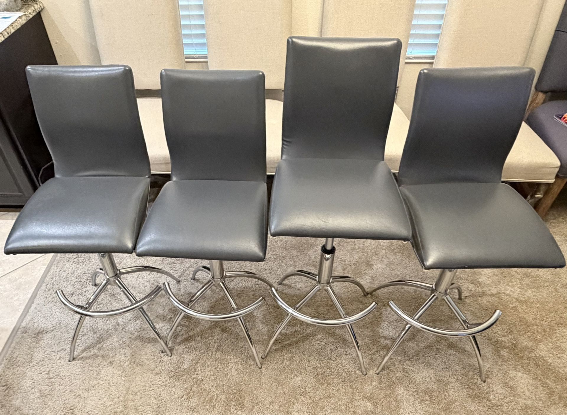 Four Grey Swivel Bar Stools