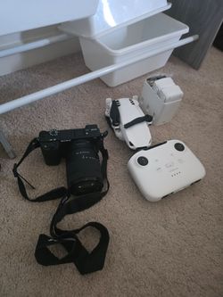 Sony Alpha Mirrorless Camera with Lens and Strap and a drone smart 8k mini