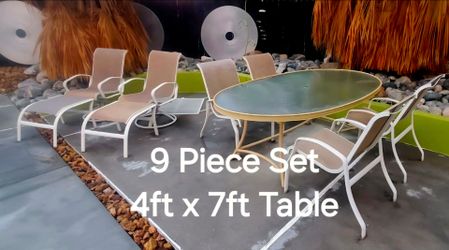 Complete 9 pc Outdoor Set 4ftx7ft Table and 6 Chairs and 2 Footrest
