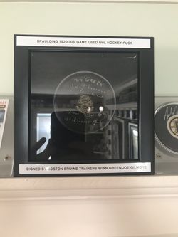 1930s Spaulding hockey puck signed by bruins trainers