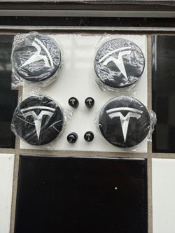 Tesla center caps and valve stem caps 20 firm