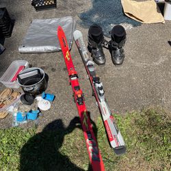 Two Sets Of Skis, And One Pair Of Boots
