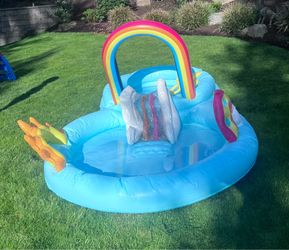Backyard rainbow water tub with slide