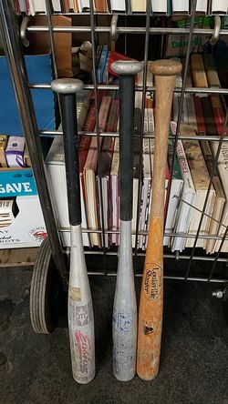 Assorted wooden & aluminum baseball bats