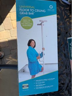 Floor to ceiling grab bar