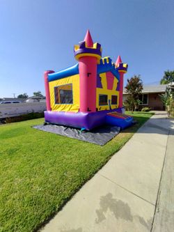 castle with basketball hoop and slide