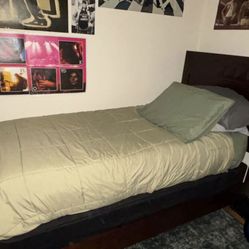 Chestnut brown twin bed, mattress, and box spring 