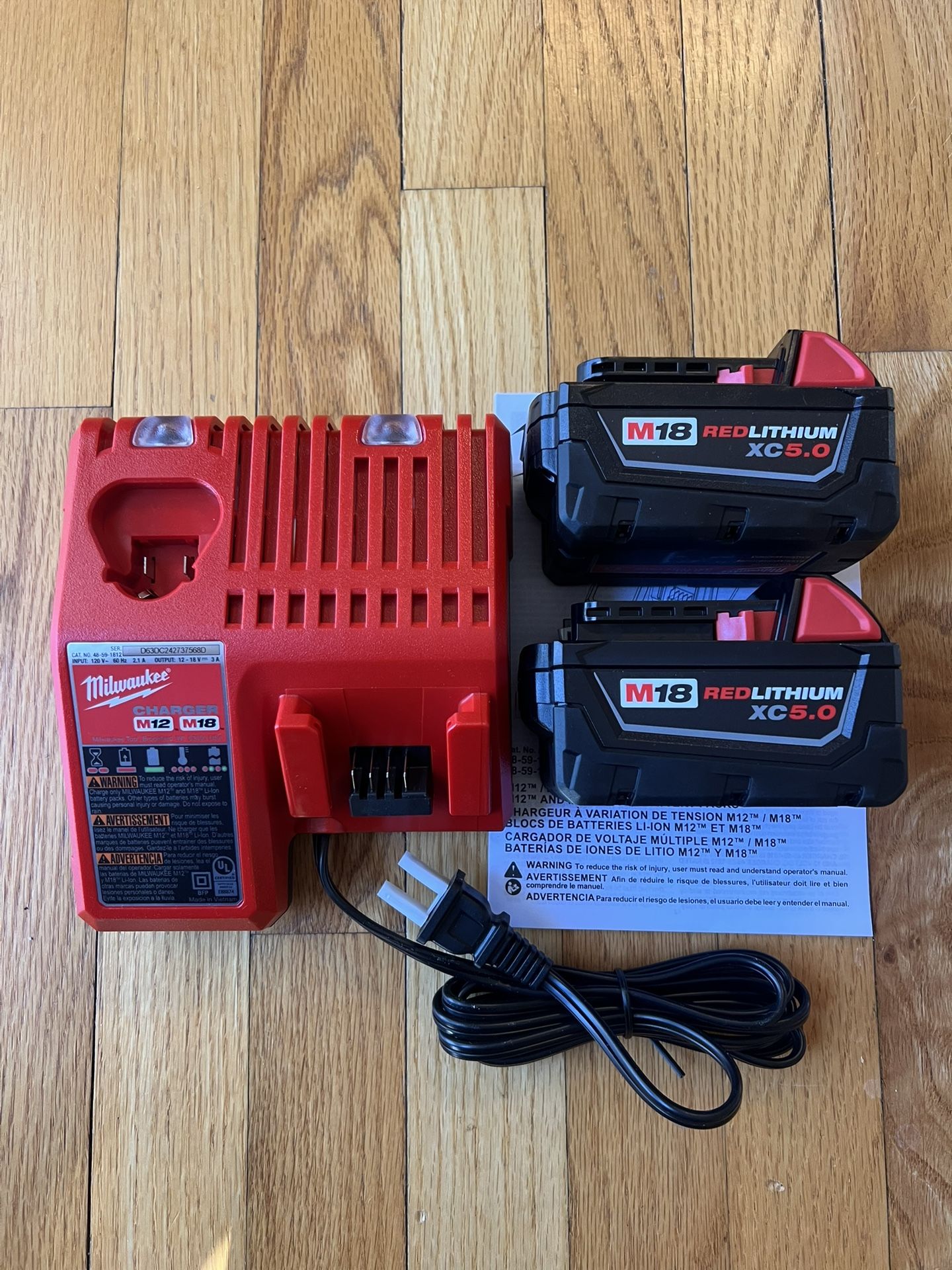 Milwaukee M18 XC5.0Ah battery ( 2-pack) And M18/M12 Charger Kit (New)