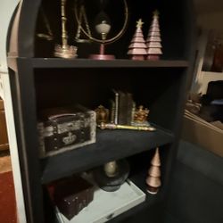 Arched Black Cabinet With Open Shelving And Closed Storage