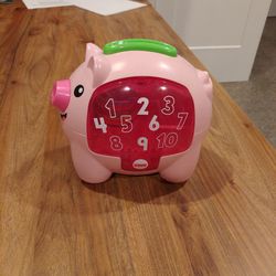 Fisher-Price Baby Musical Toy Laugh & Learn Count & Rumble Piggy Bank with Songs & Motion

